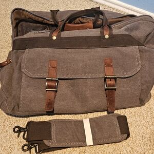 Brown canvas duffel / overnight bag. About 20x11x11in. Shoulder strap included.